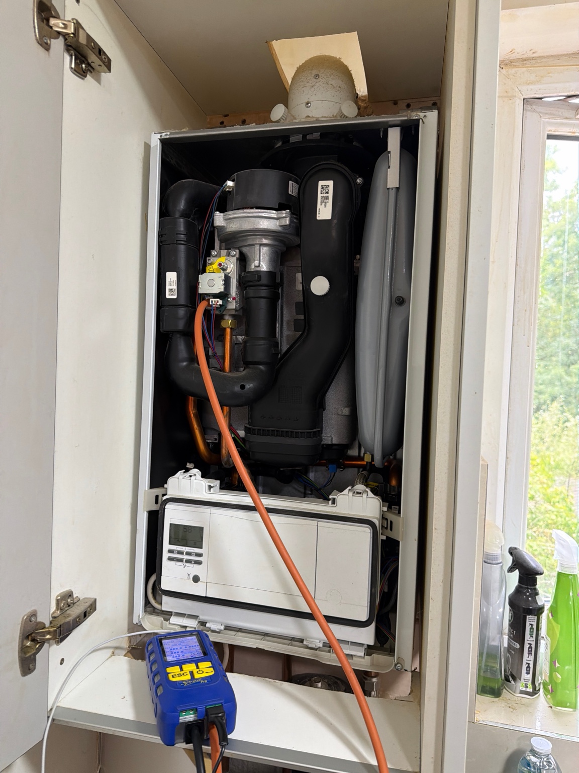 Test equipment connected to the boiler during gas checks