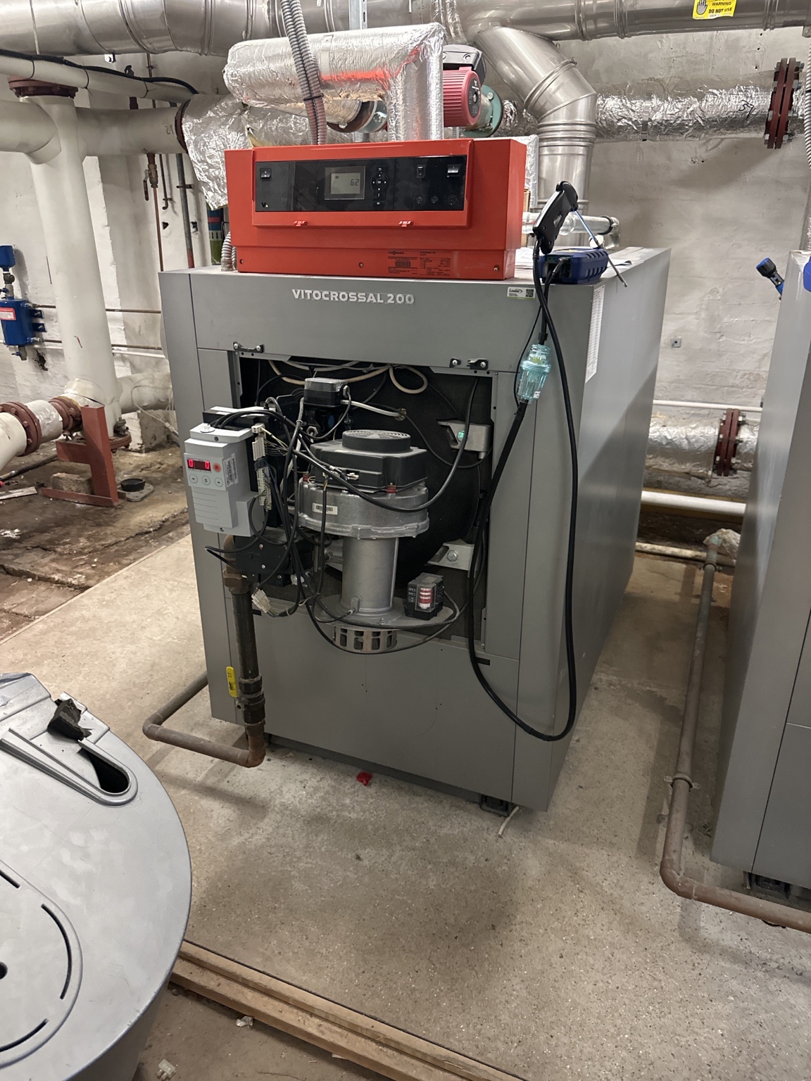 Viessmann commercial boiler with burner cover removed and flue-gas analyser connected