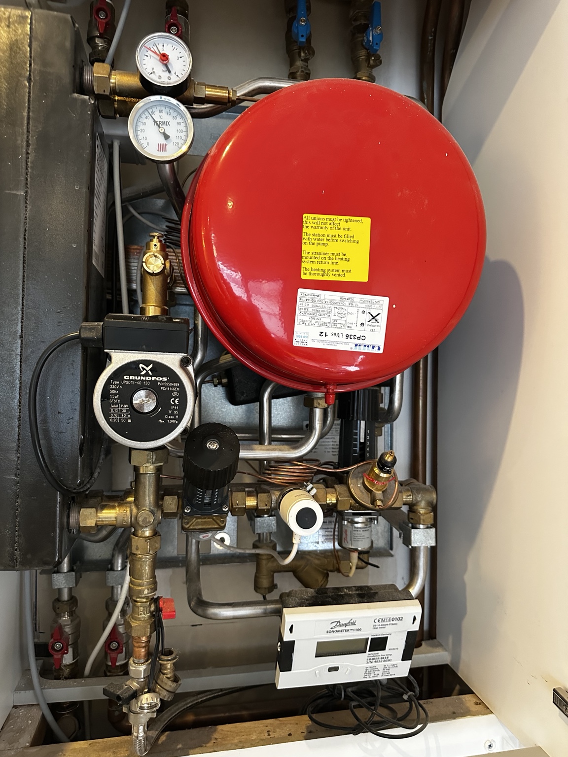 Open heat interface unit showing expansion vessel, pump and heat exchanger