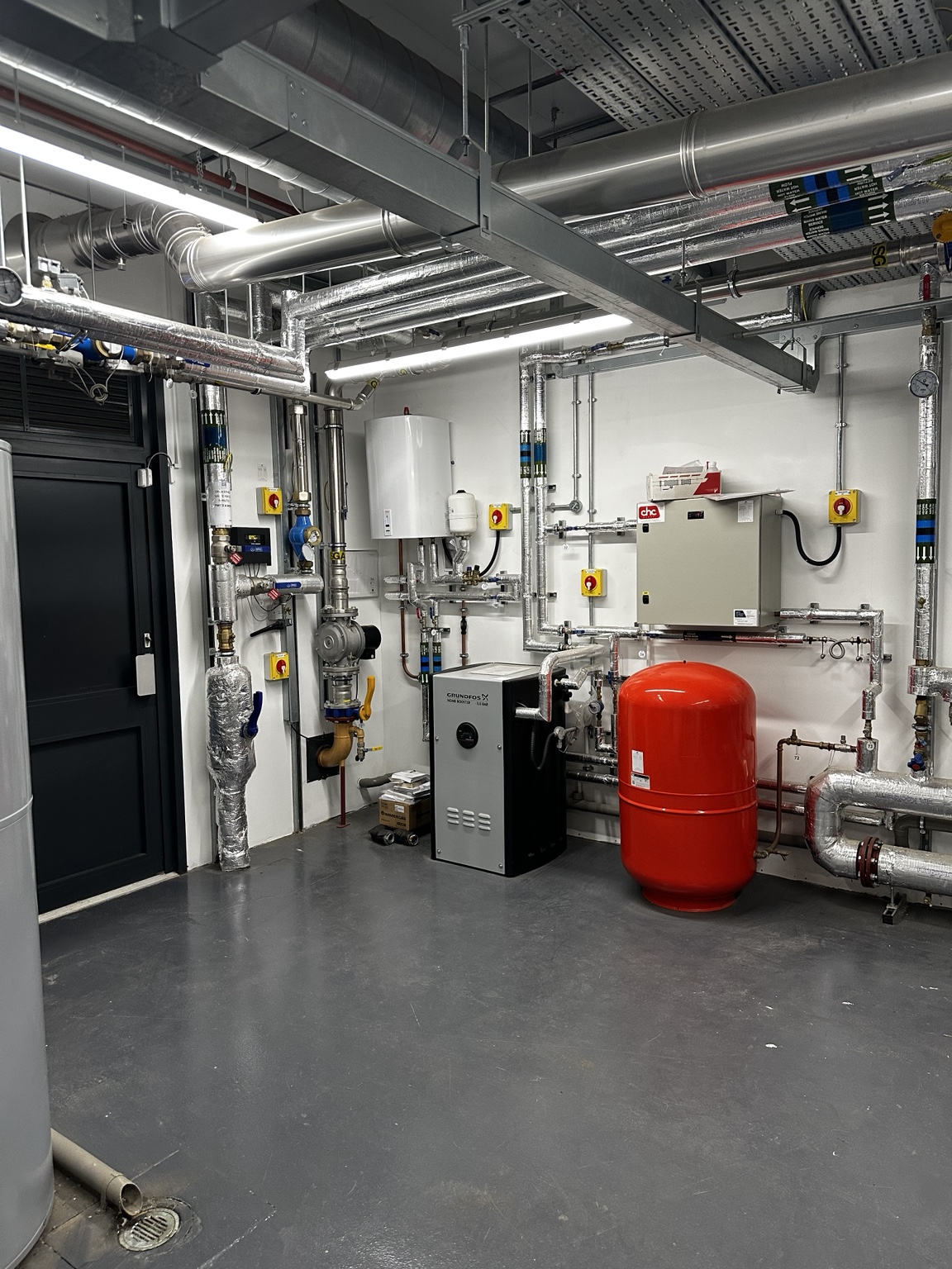 Plant-room expansion vessel, pumps, controls and insulated pipework